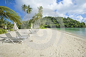 Beautiful view landscape of lounge chairs on tropical beach, the emerald sea and white sand against blue sky, Maya bay in phi phi