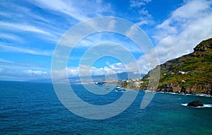 Beautiful view of Las Aguas, San Juan de la Rambla coastline with transparent turquoise blue ocean water in the foreground.
