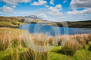 Beautiful view of Loch Leathan and Old man of Storr rock formations, Skye