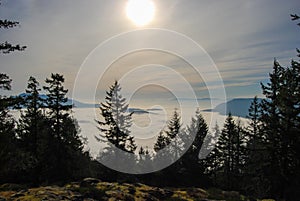 Beautiful view from a lookout over a cloud and fog filled valley in British Columbia