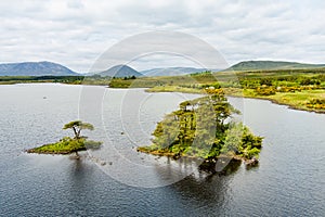Beautiful view of Lough Bofin lake in Connemara region in Ireland. Scenic Irish countryside landscape with mountains on the