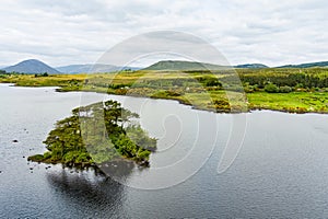 Beautiful view of Lough Bofin lake in Connemara region in Ireland. Scenic Irish countryside landscape with mountains on the