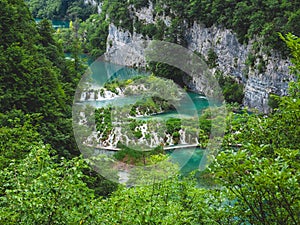 Beautiful view of the lush forest with majestic cliffs and waterfalls. Plitvice Lakes National Park