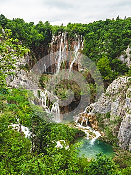 Beautiful view of the lush forest with majestic cliffs and waterfalls. Plitvice Lakes National Park