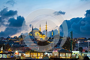 Beautiful view of the magnificent historical Suleymaniye Mosque with small boats. Istanbul photo