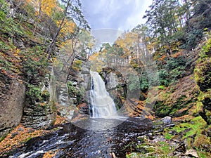 Beautiful view of the main waterfall surrounded by stunning fall foliage near Bushkill Falls, Pennsylvania, U.S.A