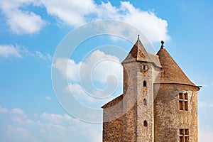 Beautiful view of medieval castle square towers over blue sky