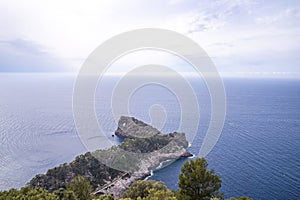 Beautiful view of Mediterranean sea and rocky cliff against cloudy sky in summer