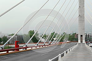 Beautiful view of modern bridge with asphalt road near mountain photo
