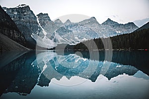 Beautiful view of Moraine lake with a reflection of snow covered mountain range