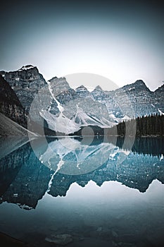 Beautiful view of Moraine lake with a reflection of snow covered mountain range