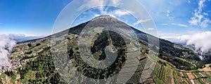 beautiful view of Mount Sumbing when the weather is clear, the sky is blue with a few clouds. Located in Central Java, Indonesia
