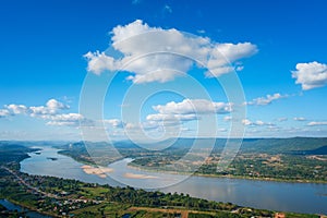 Beautiful view from Mountain green valley stream landscape to Mekhong river and clouds on the blue sky, Nongkai, Thailand