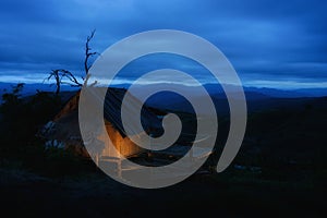 Beautiful view of a mountain hut in the evening