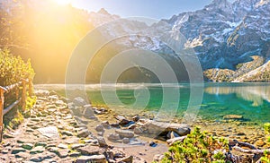 Beautiful view of the mountain lake at sunrise in the Tatra Mountains.