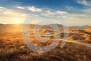 Beautiful view at the mountain valley at sunset in summer