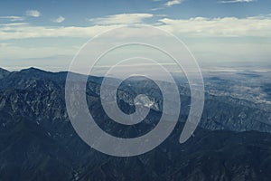 Beautiful view of mountains while watching out of the plane window approaching Los Angeles