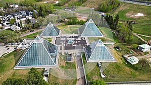 Beautiful view of the Muttart Conservatory in Edmonton, Canada, with four glass pyramid structures