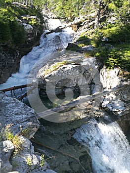 Beautiful view of nature scene in mountains with waterfall in Tatra, Slovakia