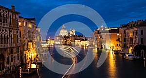 Beautiful view in the night at Cityscape image of Grand Canal in Venice, with Santa Maria della Salute Basilica reflected in calm