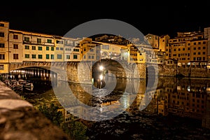 Beautiful view of the Old Bridge (Ponte Vecchio) over the Arno River in Florence, Italy at night