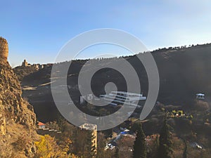 Beautiful view of the old fortress overlooking the botanical garden. Old Tbilisi, winter in the city