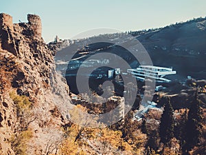 Beautiful view of the old fortress overlooking the botanical garden. Old Tbilisi, winter in the city