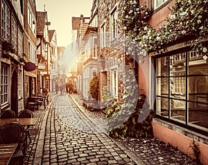 Old town in Europe at sunset with retro vintage filter effect