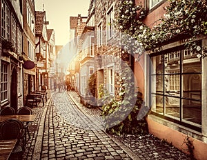 Old town in Europe at sunset with retro vintage filter effect