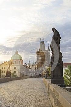 Beautiful view of Old Town Tower of Charles Bridge at dawn in Prague, Czech Republic