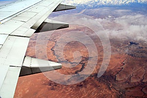 Beautiful view over the desert, seen from jet plane`s window seat