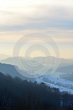 Beautiful view over Odenwald with snow at sunset in winter in Germany