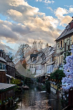 Beautiful view over a water canal and traditional half timbered houses in the french city of Colmar