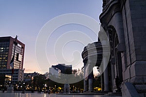 Beautiful view of Palace of Fine Arts and Mexico City under sunset sky