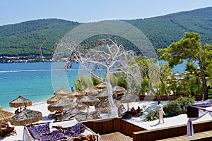 Beautiful view of Paradise tropical Bodrum beach at Lujo hotel in Turkey, Beach bed, bean bag chair and umbrella for photo