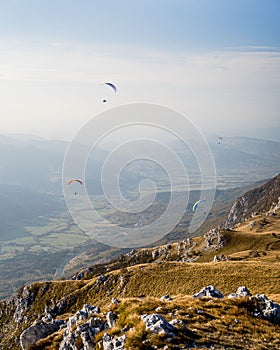 Beautiful view of Paragliding pilots over Vipava valley, Slovenia