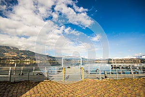 Beautiful view of the pier in San Pablo lake in a beautiful day with blue sky and some clouds