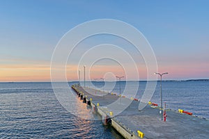 Beautiful view of a pier sunset in Tallinn. Blue sky landscape. Estonia marine at evening.