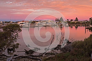 Beautiful view of pink sky over Lake Butler boat marina during s