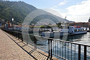 Beautiful view point from Como quay on lake, city and mountain, sunny day, Como, Italy, summer 2016