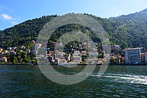 Beautiful view point from Como quay on lake, city and mountain, sunny day, Como, Italy, summer 2016