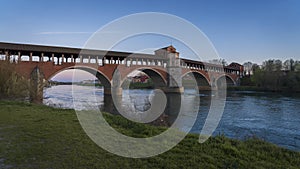 Beautiful view of Ponte Coperto Pavia (covered bridge) at blue hour