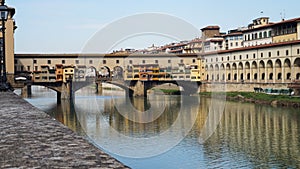 Beautiful view of Ponte Vecchio bridge over River Arno, Florence, Italy photo
