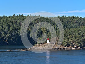 Beautiful view of Portlock Point Lighthouse on Prevost Island, part of the Gulf Islands in British Columbia, Canada.
