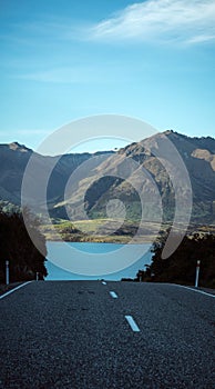 Beautiful view from the road to Glenorchy with the Wakatipu Lake and the mountain in the background taken on a winter day in