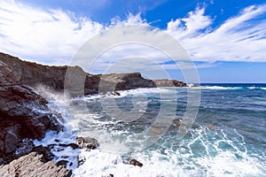 Beautiful view of a rocky bay with waves on the sea on the island of Menorca, Balearic islands, Spain