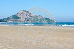 Beautiful view of a rocky cliff by the sea under a bright sky