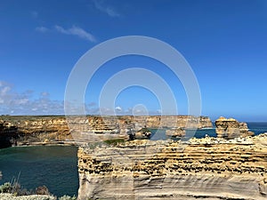 Beautiful view of the rocky Great Ocean Road with The Razorback on water in Australia