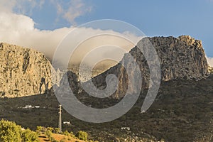 Beautiful view of rocky mountains with a very low cloud