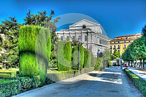 Beautiful view on the Royal Theatre (Teatro Real) from the Plaza de Oriente on the blue sky background with white clouds in Madrid photo